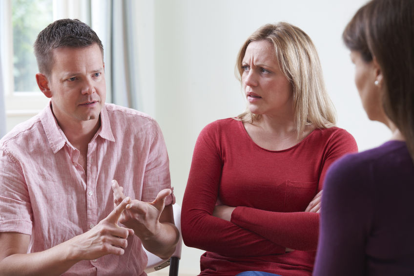 couple being counselled by a pastor
